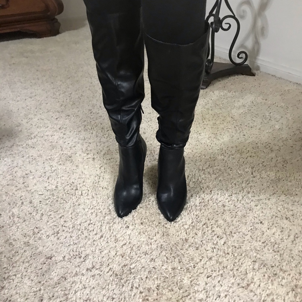 Leather high heel boots.